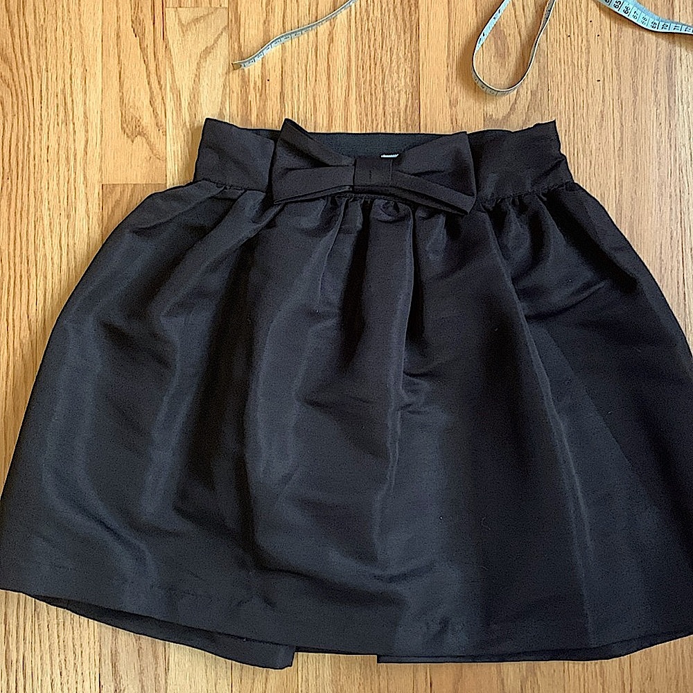 Kimchi Blue brand black skirt with bow size medium